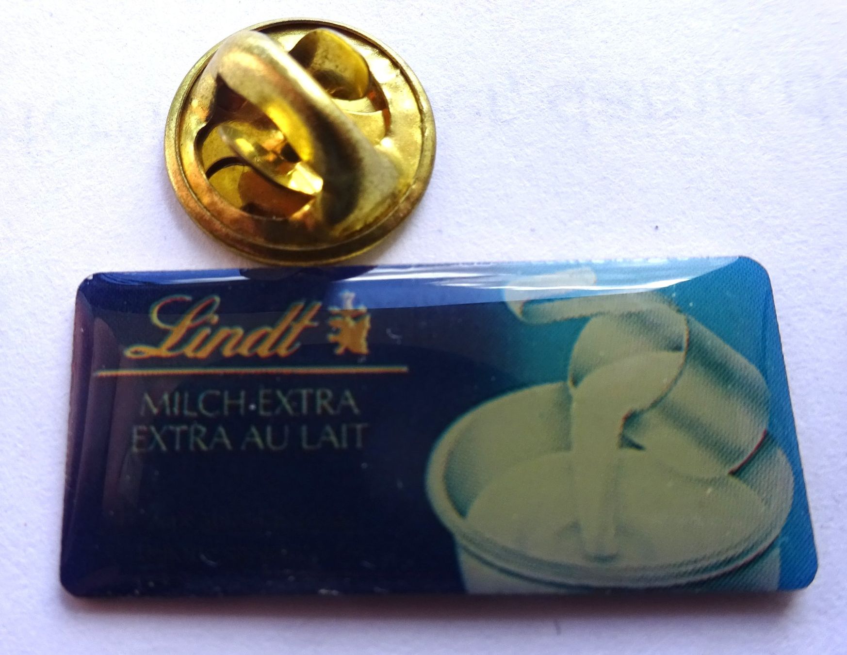 Plaketten & Abzeichen: Pin Schokolade MILCH Lindt – Gebraucht aus Utzenstorf von BUtter81