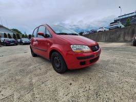 Red Fiat Idea for sale, perfect for summer road trips!