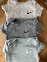 Set of 3 Nike baby bodysuits