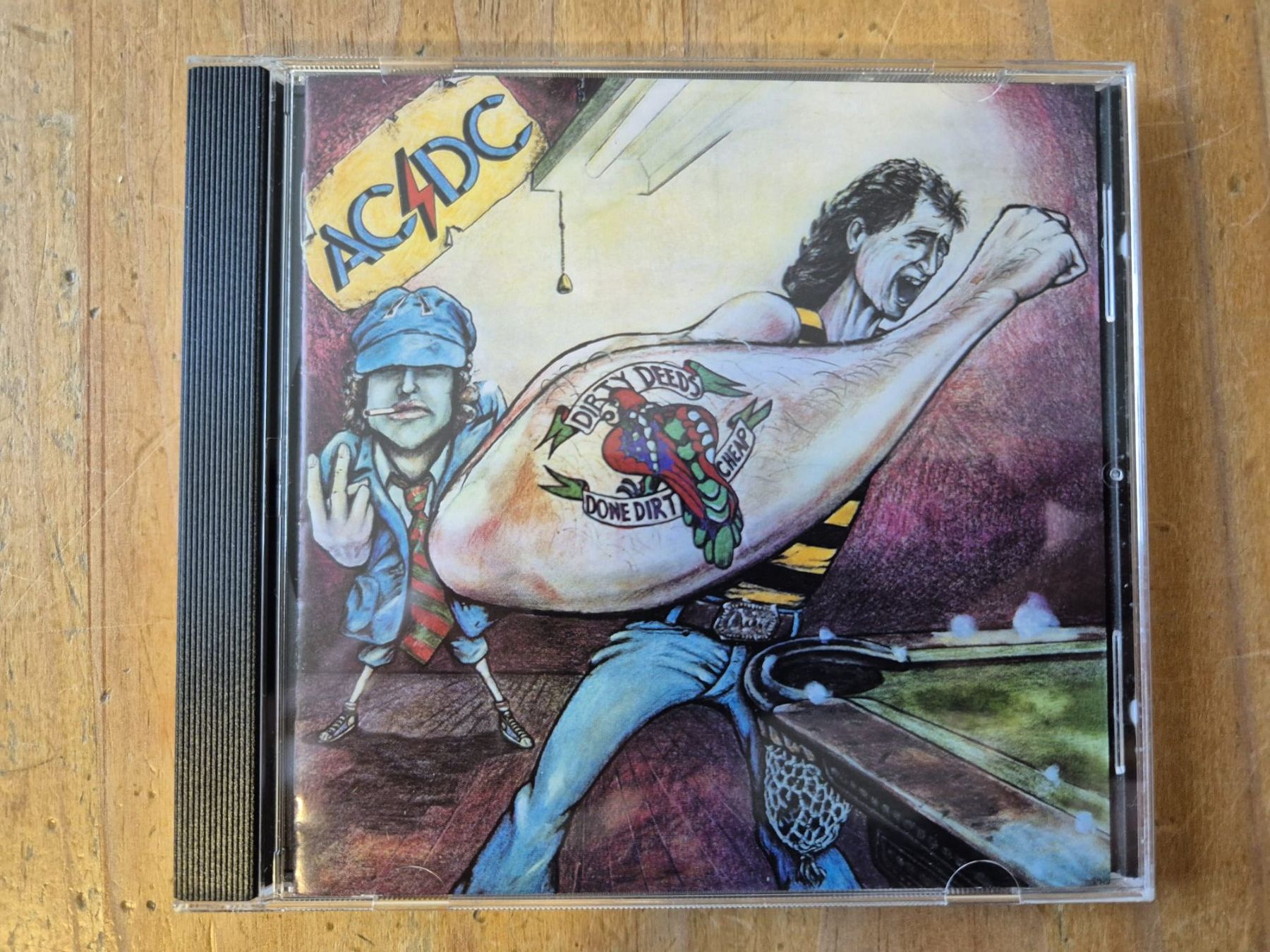 CD: AC/DC - DIRTY DEEDS DONE DIRT CHEAP - AUSTRALIEN CD – Usato da Basel venduto da Patiscat