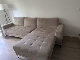 Divano angolare beige con penisola letto usata