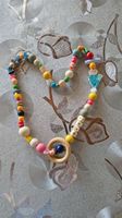 Kette mit Holzring und Motiven handgemacht