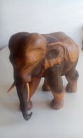ELEPHANTENBULLE, STOSSZAEHNE, EDELHOLZ, CA. 32 CM GROSS
