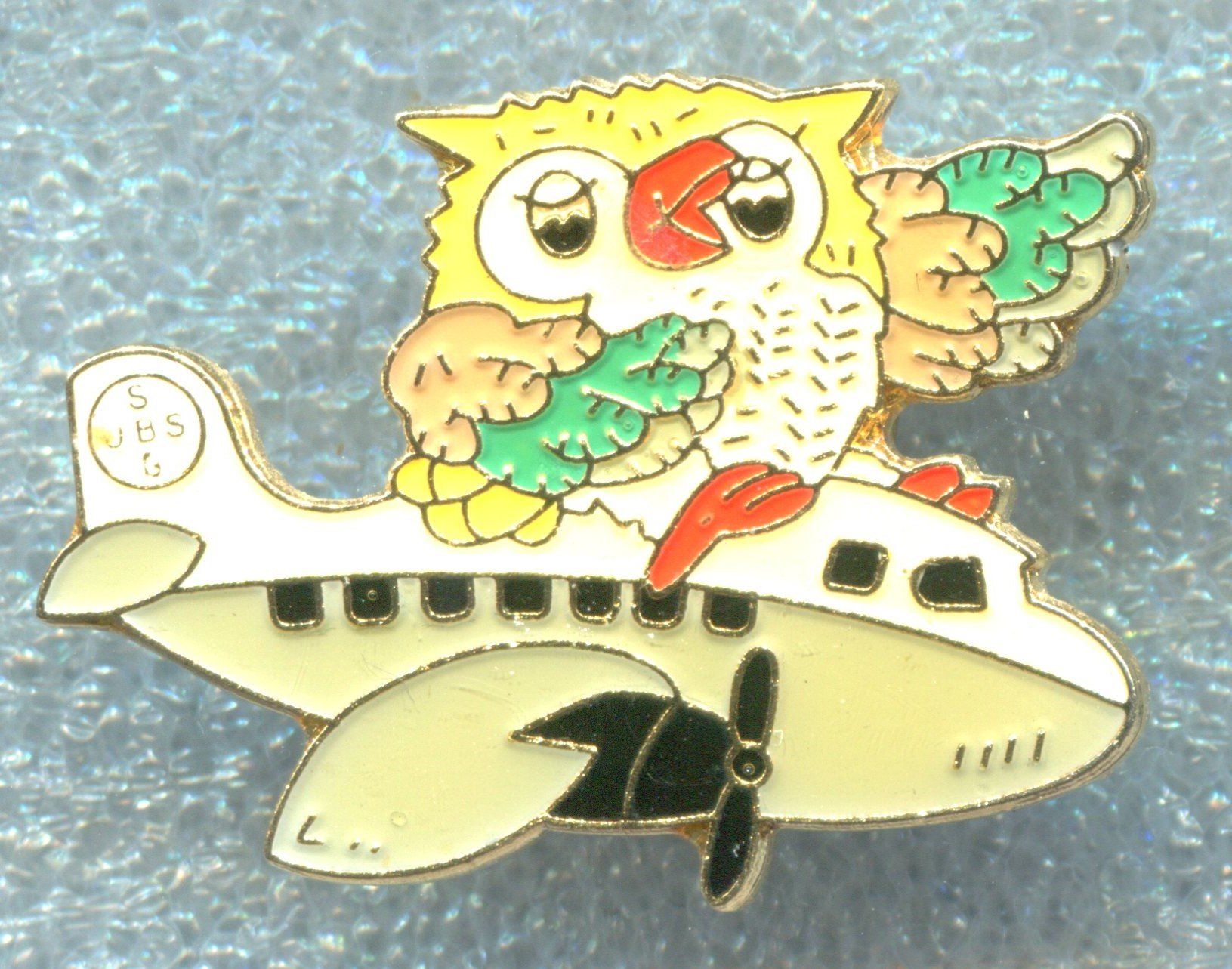 UBS Plaquettes & Badges: UBS  Eule  mit Flugzeug – D'occasion à Winterthur par Sammleroase
