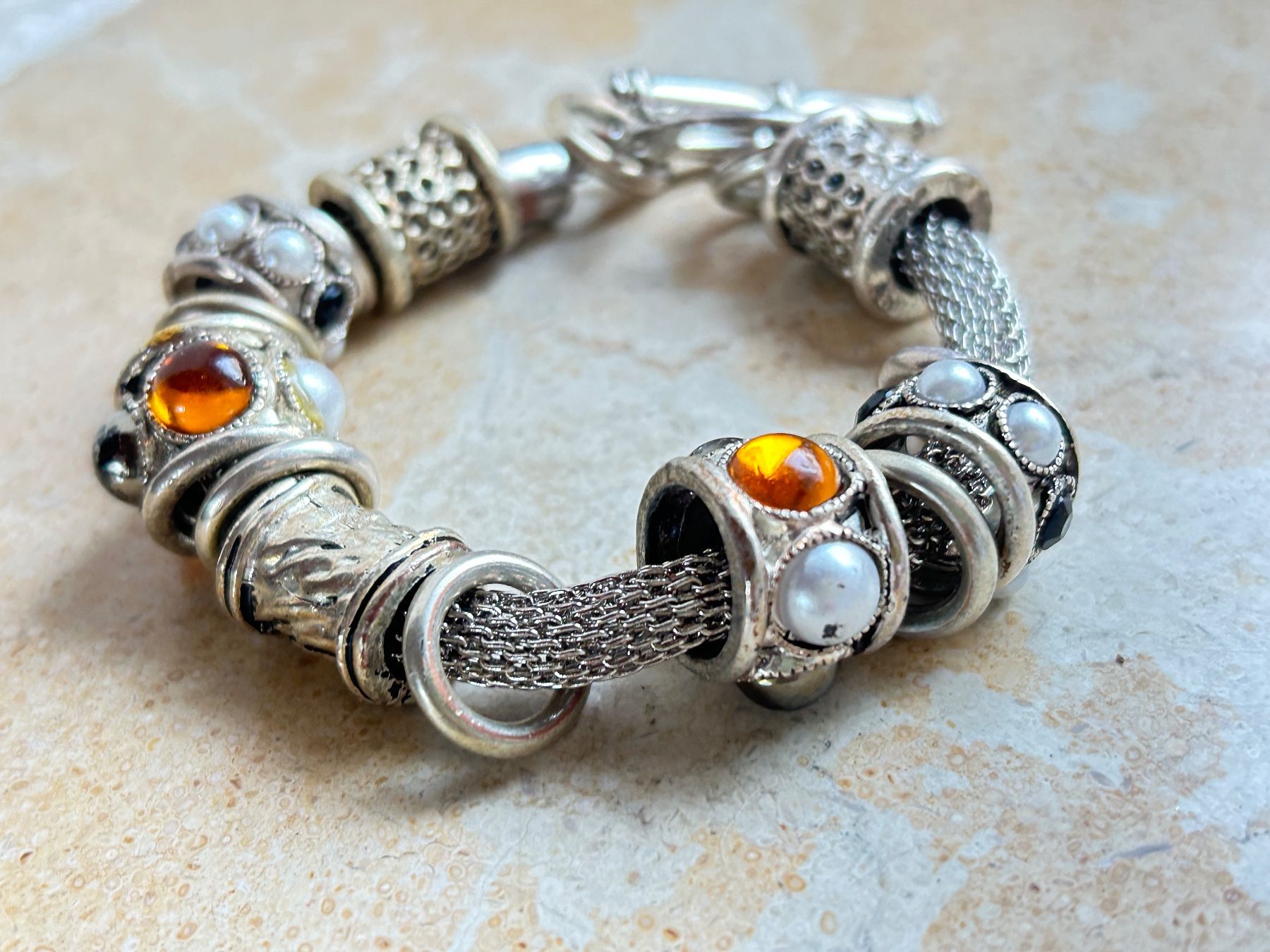 Bracciali & Braccialetti: ARMBAND orange-schwarz – Usato da Laufen venduto da Bellebellezza