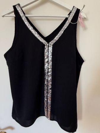 Haut noir avec paillettes taille M