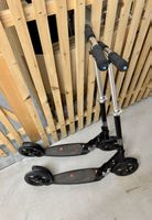 Zwei Micro-Scooter Trottinett
