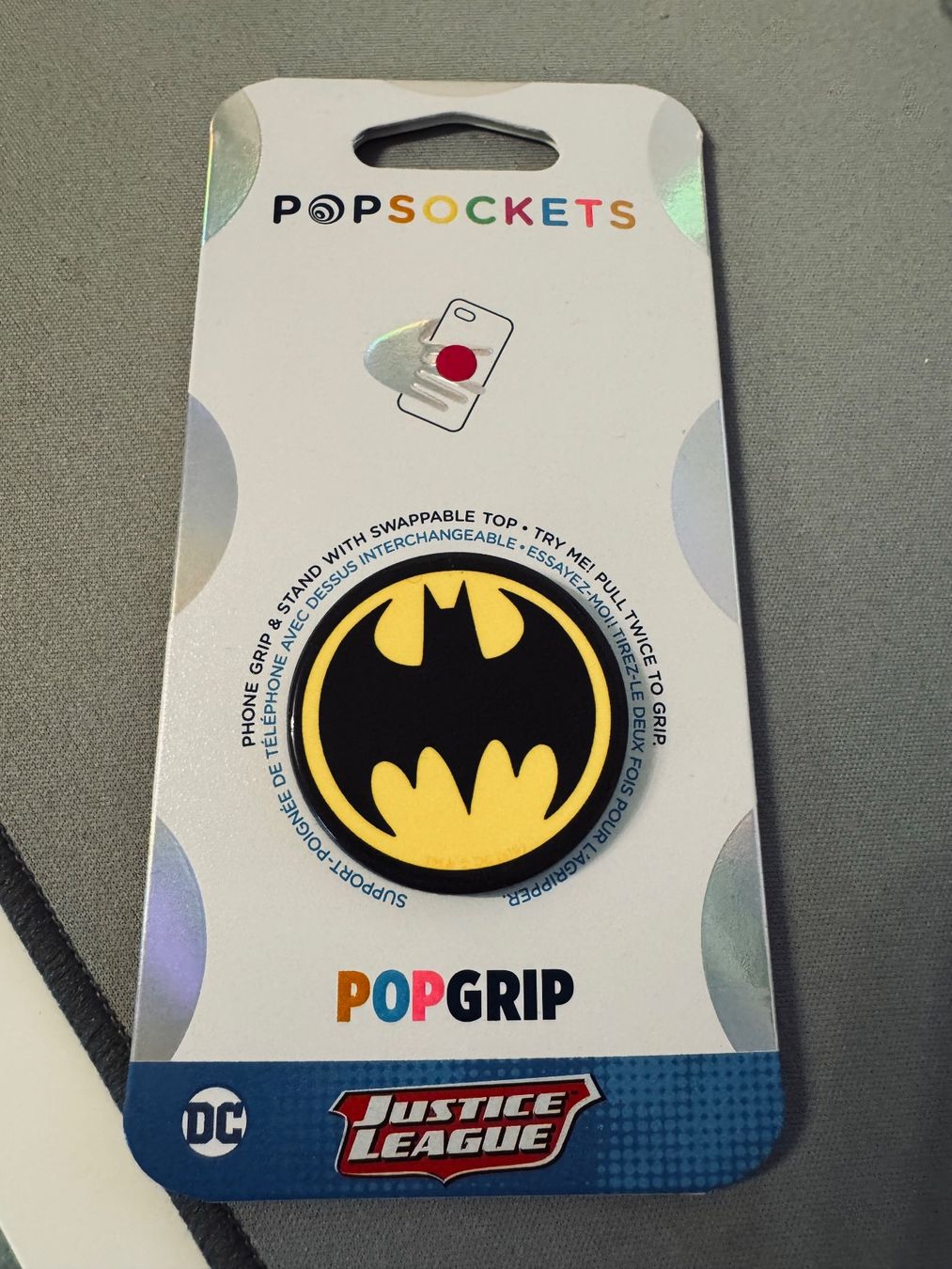 Supporti a parete: Popsockets / Justice Leage / Batmanlogo aus den 80igern – Nuovo e nell'imballaggio originale da Winterthur venduto da Brigitta5