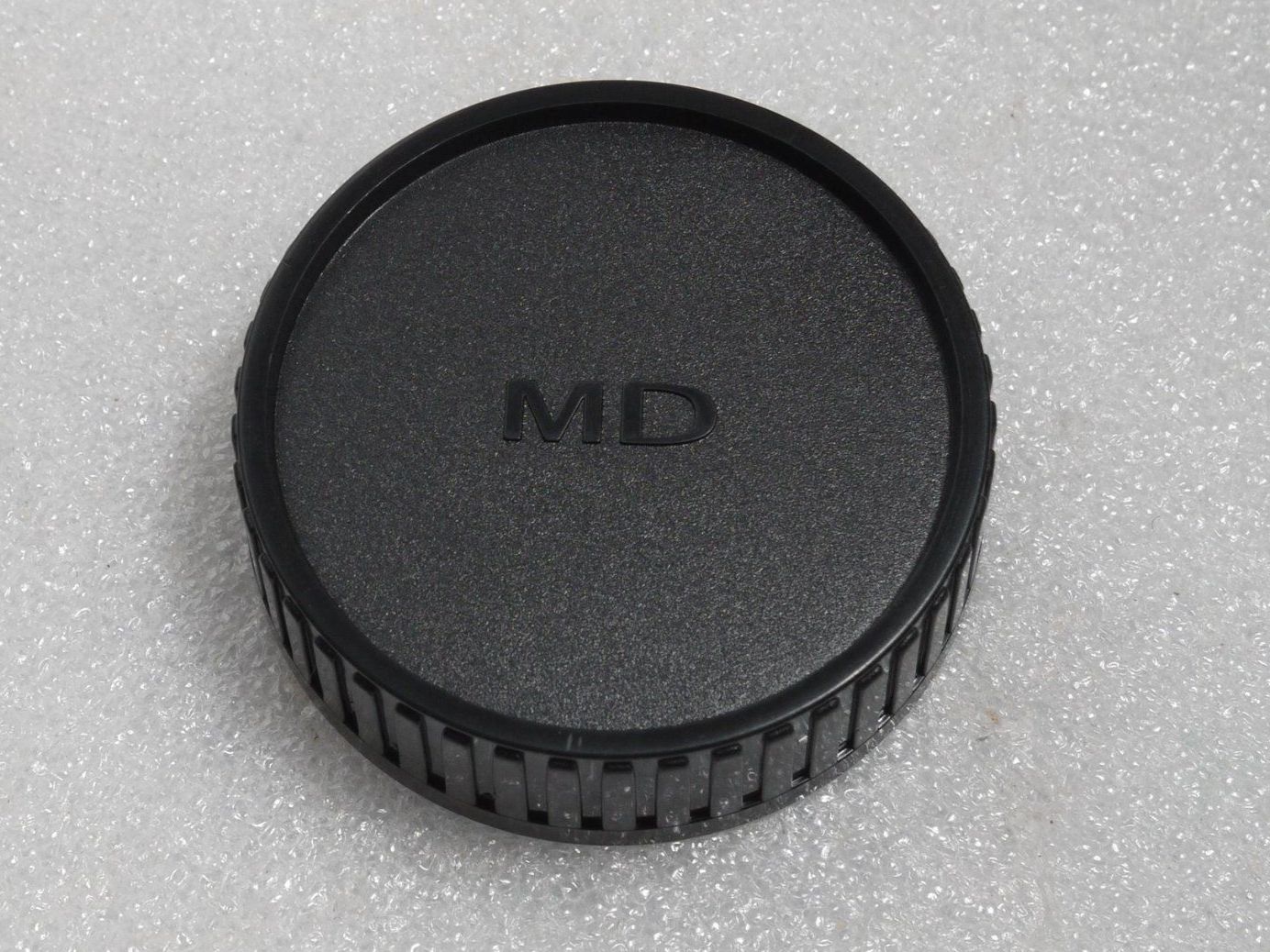Minolta Obiettivi: Minolta MD Rückdeckel / bouchon arrière / Rear Cap. MD. – Nuovo e nell'imballaggio originale da Egg b. Zürich venduto da JCB