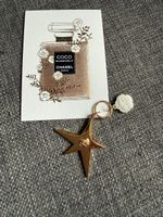 Chanel Star Camelia charm