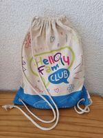 Coop Hello Family Turnbeutel & Buch Tafity&die Löwenschule