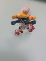 Petite Schtroumpfette sur rollers, figurine rétro vintage,