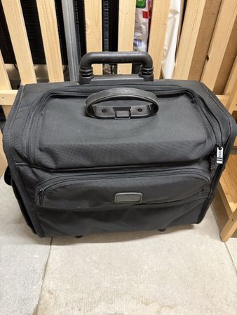 Valise cabine Tumi noire roulettes état d'usage