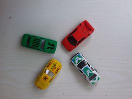4 Spielzeugautos rot, gelb, weiss, gruen gebraucht