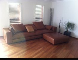 Brown leather sofa with ottoman, good condition