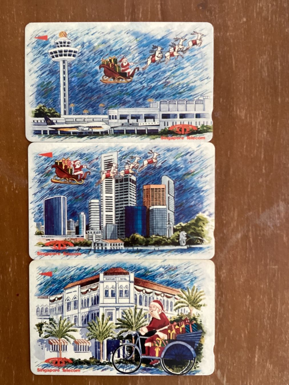 Schede telefoniche: 3 Telefonkarten Singapur Weihnachsmann – Usato da Zürich venduto da Tolima194