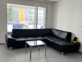 Black leather corner sofa