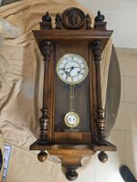 Horloge murale en bois avec balancier ,état d'occasion