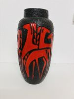 Vase en céramique noir et rouge état acceptable
