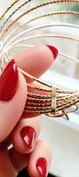 7 bracelets joncs italiens en or 18K (750) tricolore