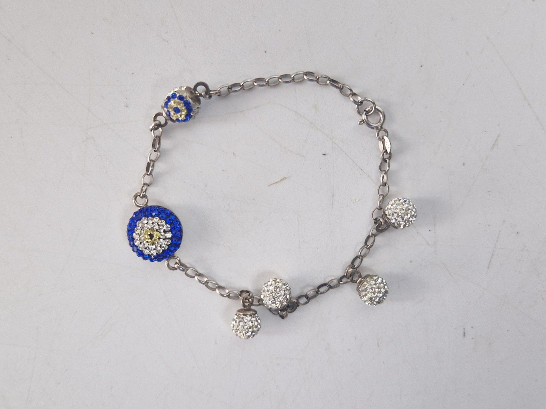 Bracelets: Armband mit Augensymbol und Strasssteinen – D'occasion à Muhen par Restwert_Muhen