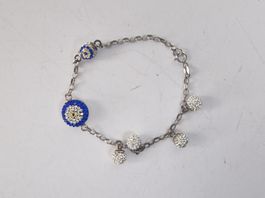 Armband mit Augensymbol und Strasssteinen