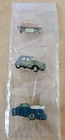 Drei Oldtimer-Pins