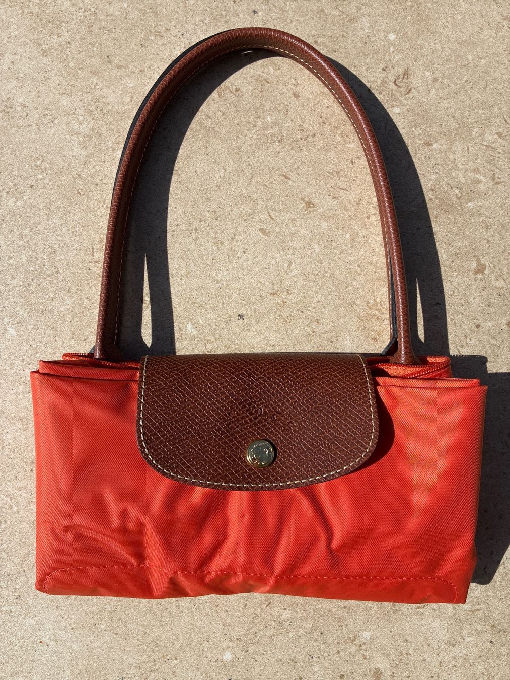 Longchamp Borse da donna: Handtasche Longchamp Le Pliage orange gebraucht – Usato da Bettlach venduto da Brissoni