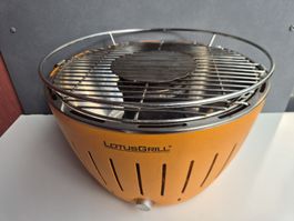 LotusGrill rauchfreier Holzkohlegrill Orange inkl. Tragetasc