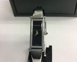 Montre bracelet Gucci femme en excellent état 