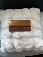 Portefeuille en cuir verni  Louis