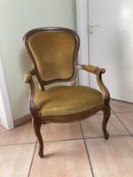 Antiker Sessel mit Armlehne