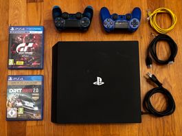 Sony PlayStation 4 Pro mit zwei Controllern und Spielen
