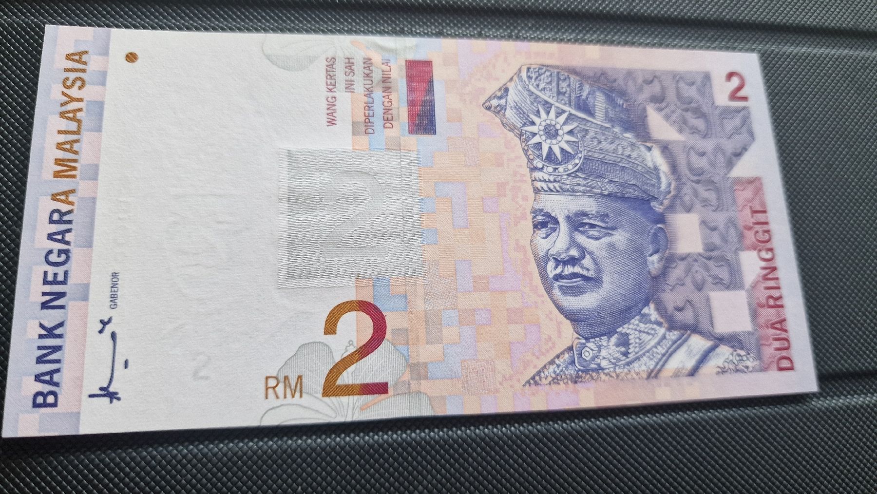 Banconote: Malaysia 2 Ringgit Schein AE6256137  NEU – Nuovo e nell'imballaggio originale da Herisau venduto da Antiques.AR