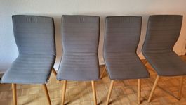 4 Esszimmerstühle Polster grau Holzbeine