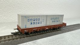 Roco Flachwagen mit HAPAG LLOYD Ladung H0 / AC