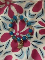 blaue Armkette mit Eule
