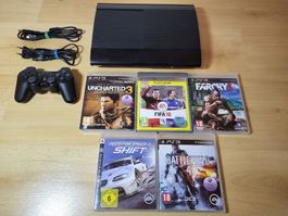 PS3 super Slim noire  - manette + 5 jeux. comme neuf