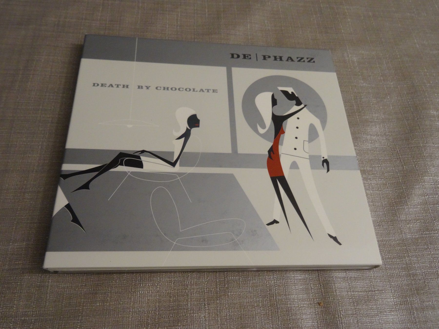 CDs: De Phazz - Death by Chocolate CD - – D'occasion à Olten par Disc-Ausverkauf