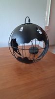 Lampe suspension noire représentant la Terre, le monde