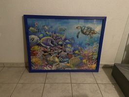 Riesiges Puzzle hinter Glas im Holzrahmen