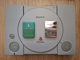 Functional PS1, 8 working games, 2 memory cards and adapter!
