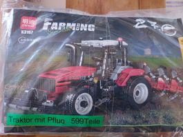 Traktor mit Frontpacker und Pflug aus Klemmbausteinen 