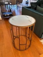 Mirror-based coffee table with golden legs