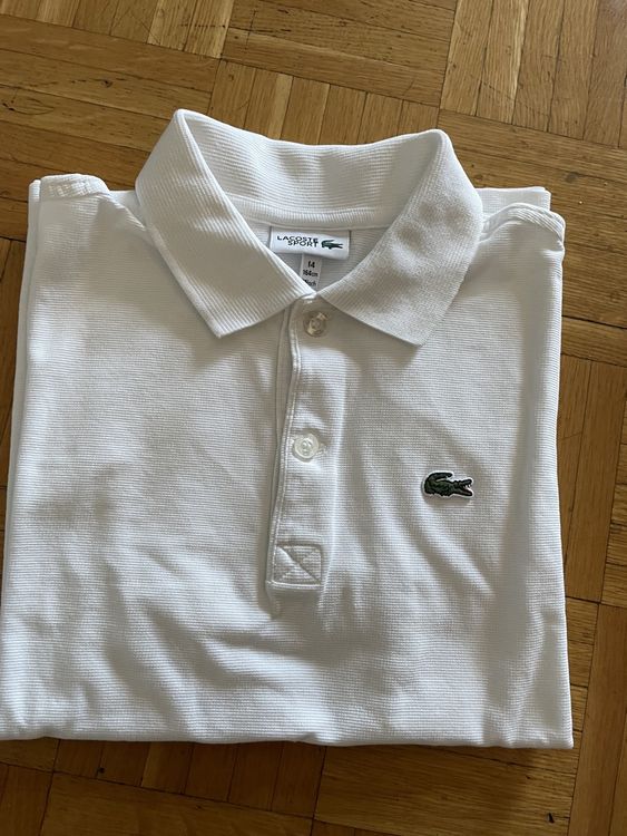 Polo Lacoste Blanc Taille 14 ans Neu gemass Beschreibung in Lausanne fur CHF 20 mit
