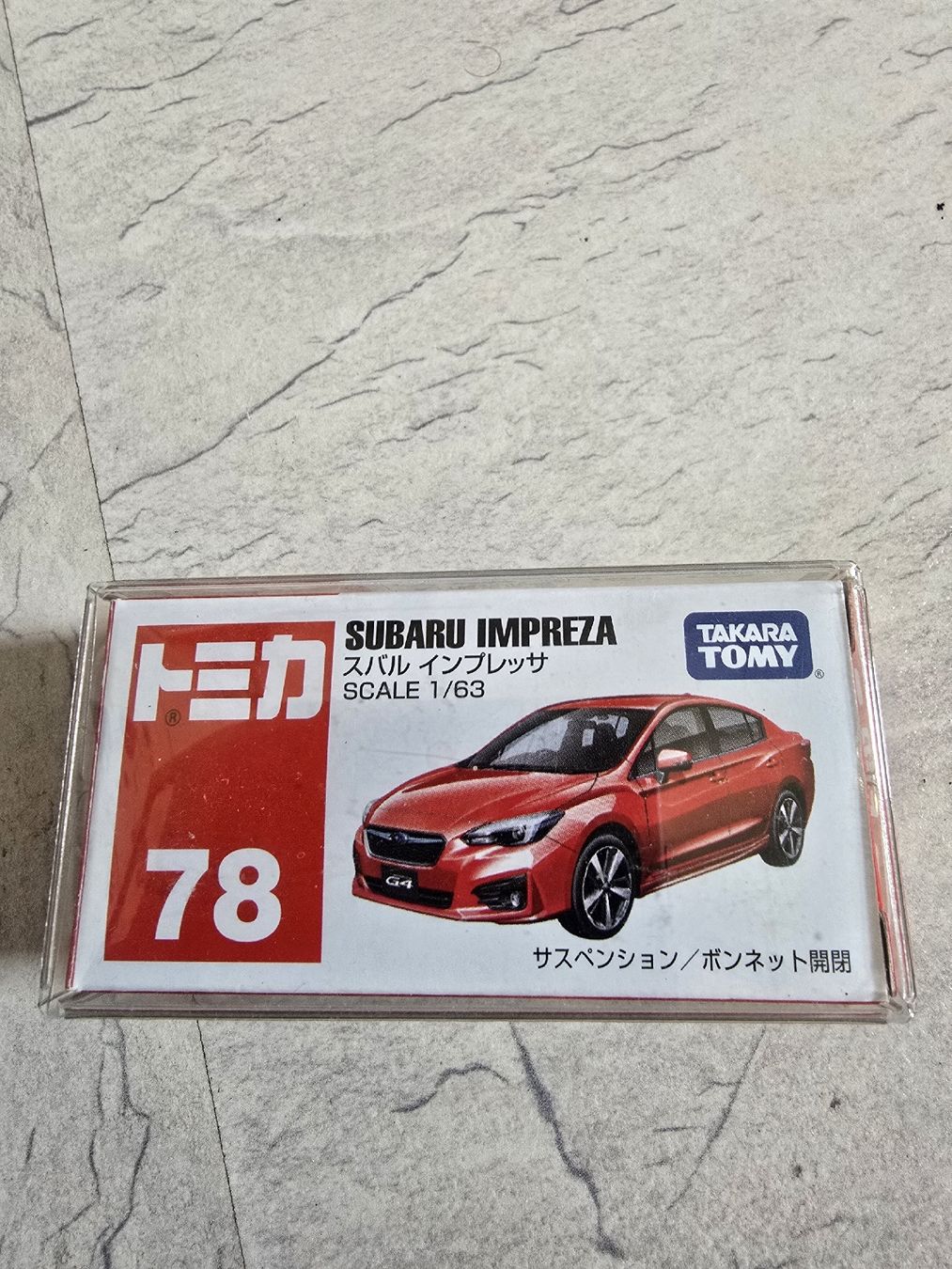 Subaru Modellini d'auto: Tomica Subaru Impreza 1/63 – Nuovo e nell'imballaggio originale da Bellach venduto da Vegeta23