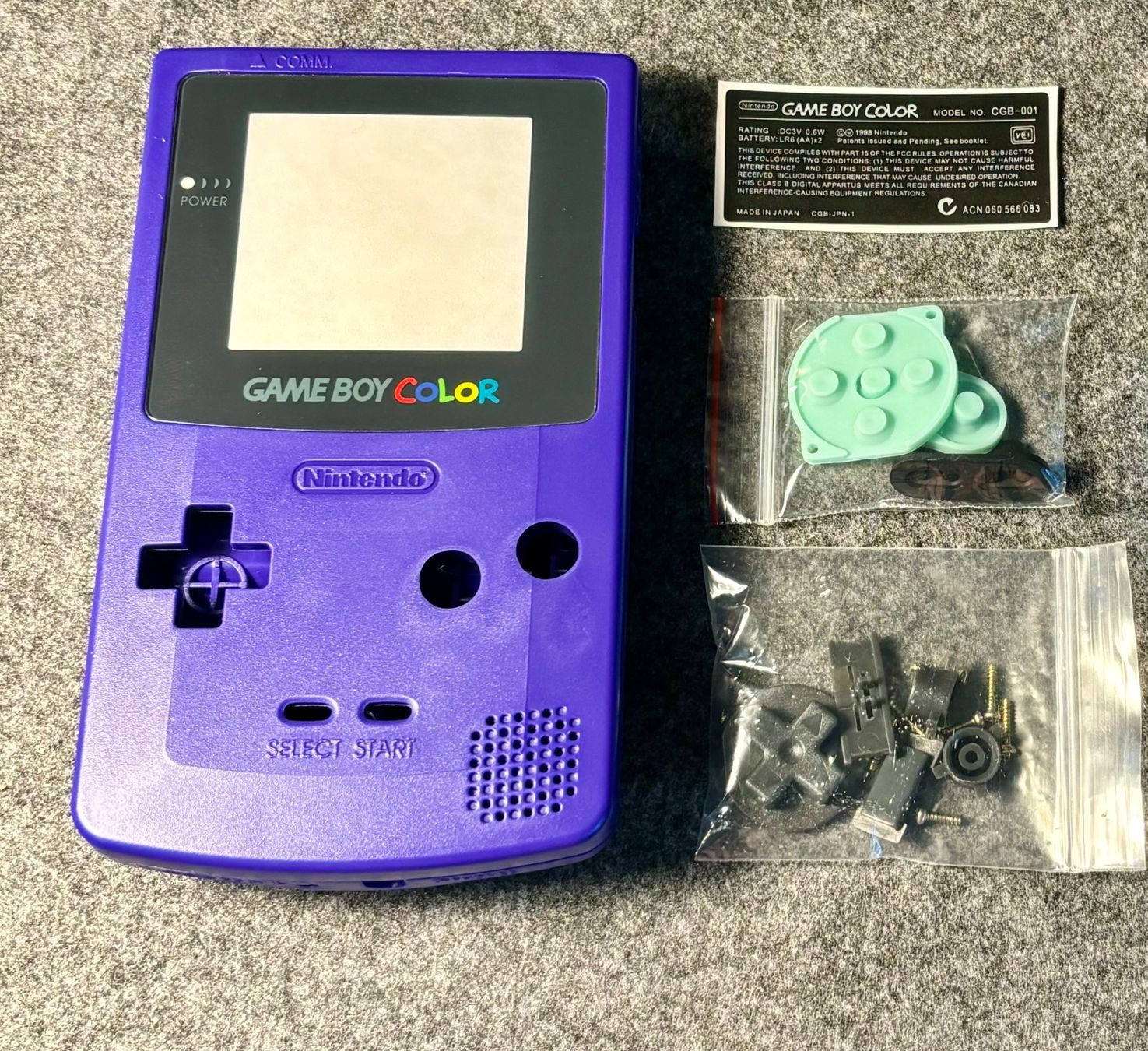 Console: Gameboy Color Violett Gehäuse / 2# – Nuovo e nell'imballaggio originale da Mollis venduto da GamingCorner