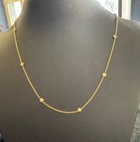 A vendre collier tour de cou or jaune serti de 10 diamants