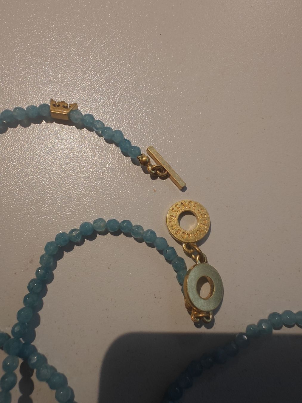 Sence Catenine: Sence Kette türkis mit Goldverschluss – Usato da Menzingen venduto da tschey-tschey