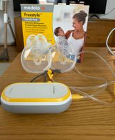 Medela Freestyle Hands-free Milchpumpe + Philips Avent Flas